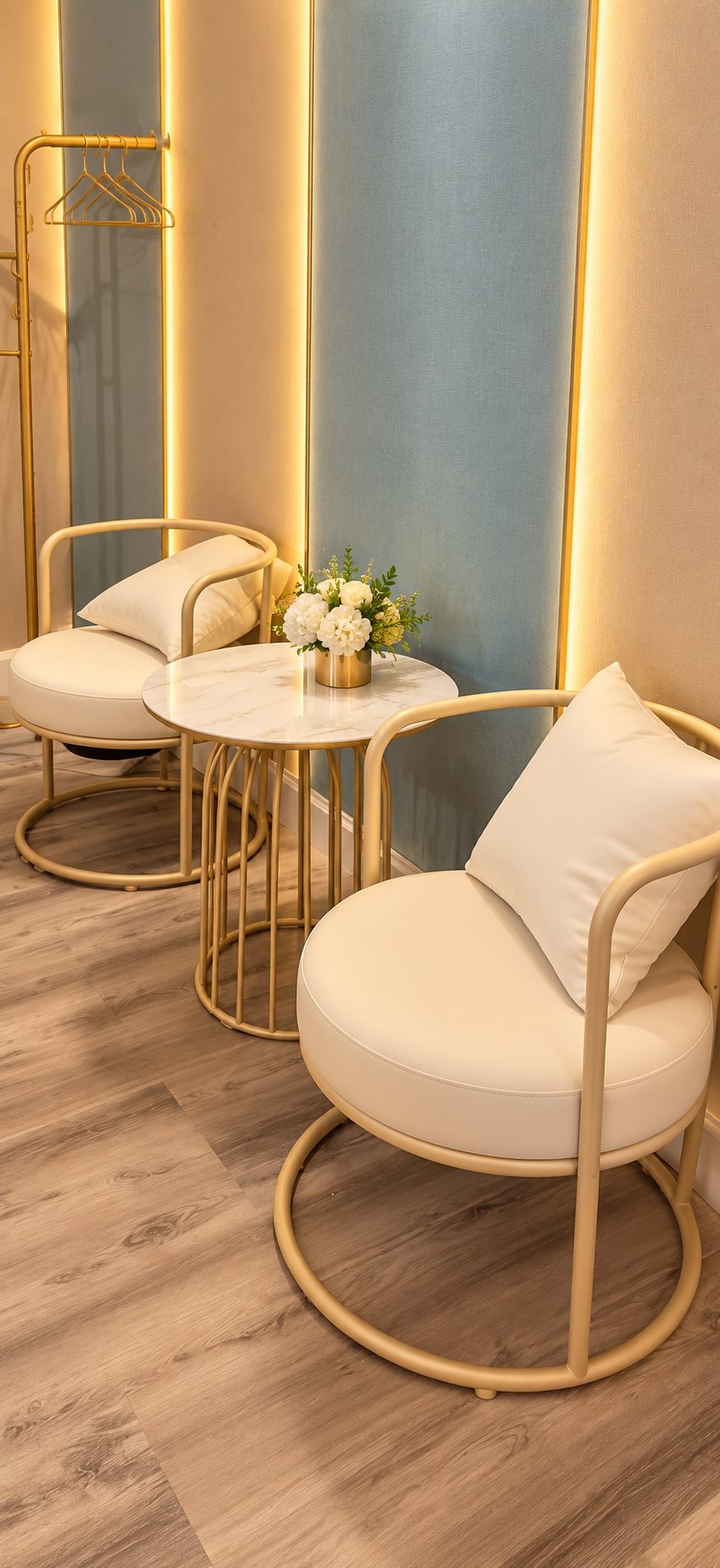 A quiet seating corner at Massage 7 with gold framed chairs