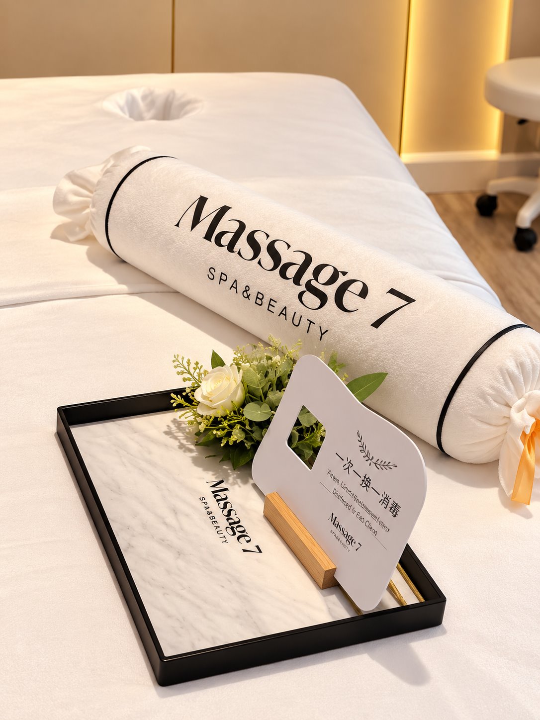 Massage 7 towels and flowers on a treatment bed