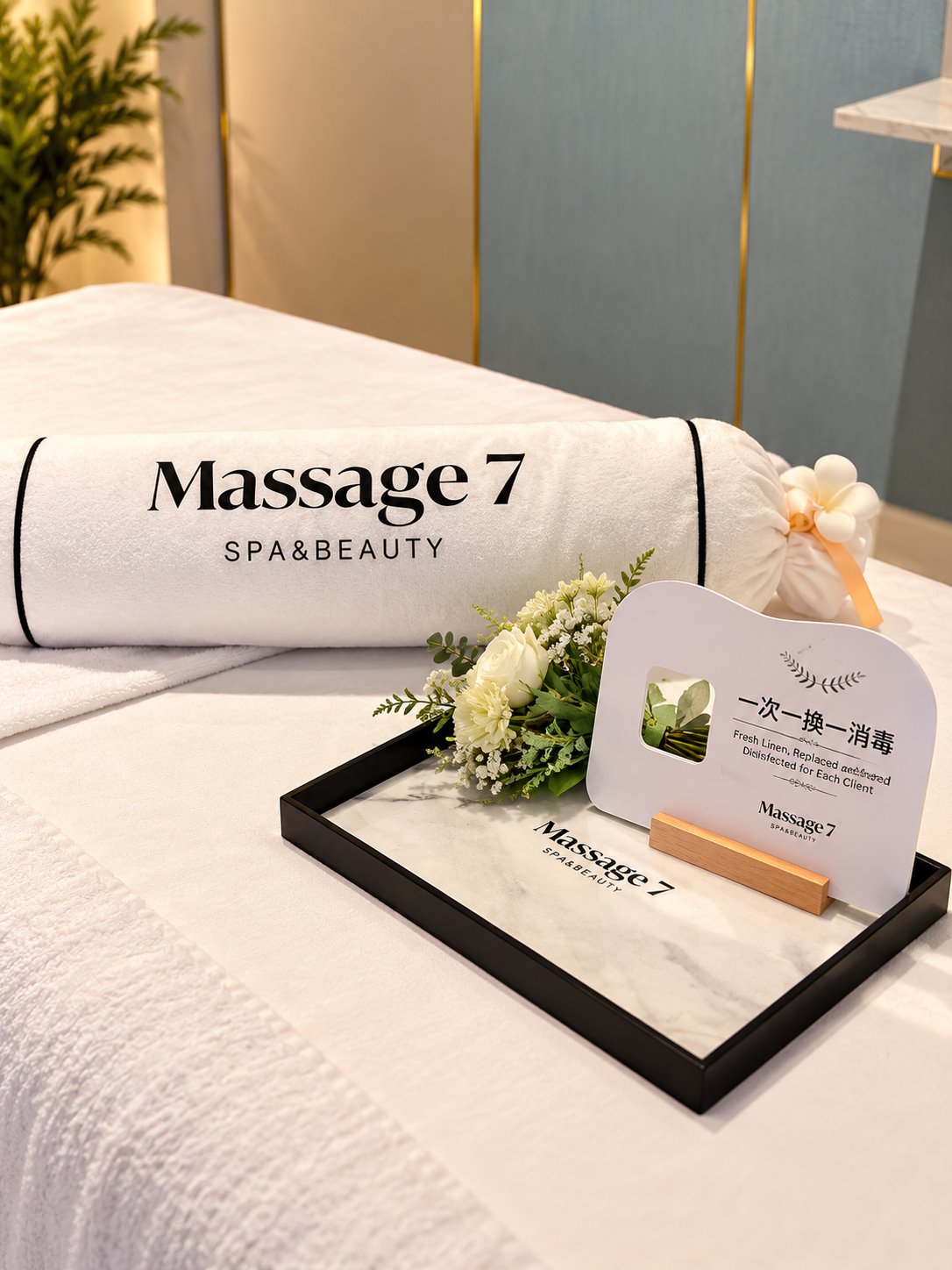 Massage 7 towel and flowers on a treatment tray